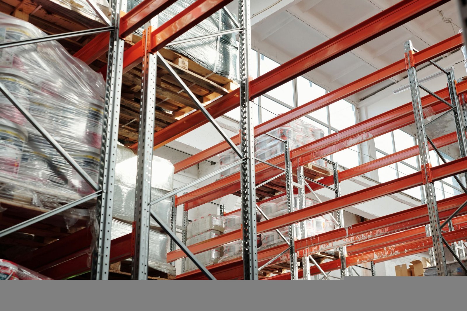 Palletized goods protected with stretch wrap on warehouse racks